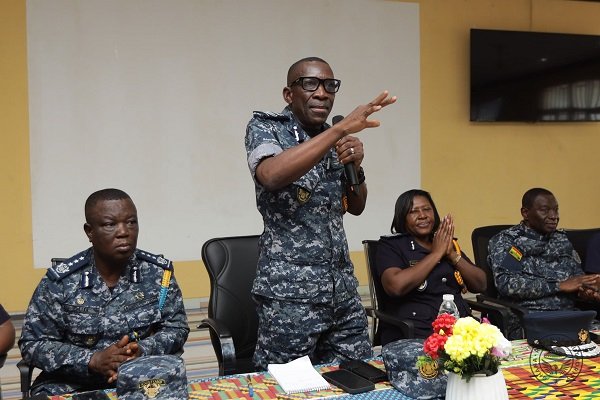 Mr Kanor (standing) addressing the staff during a tour of the checkpoints in the Volta Region