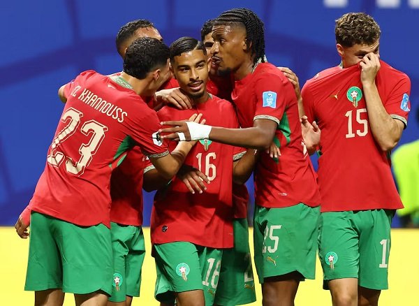 Gessime Yassine celebrates scoring their fourth goal with teammates