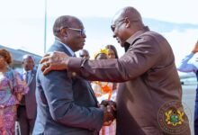 President Mahama (righ) being welcomed by President Alassane Ouattara