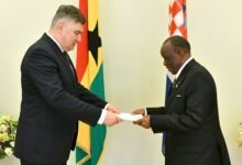 Mr. Assorow (right) presenting his letters of credence to President Zoran Milanović