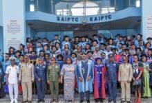 Dignitaries and graduates after the ceremony