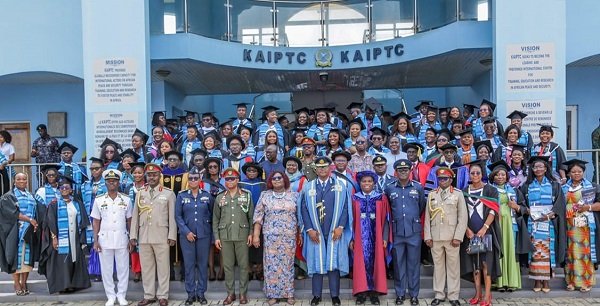 Dignitaries and graduates after the ceremony