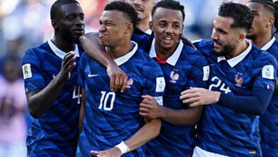Kylian Mbappé mobbed by team mates after scoring late in stoppage time