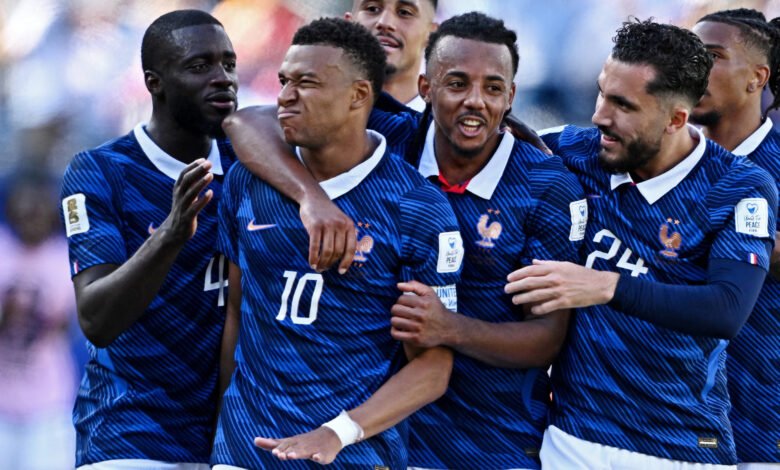 Kylian Mbappé mobbed by team mates after scoring late in stoppage time