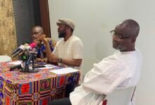 Mr Atuahene (middle) addressing the media