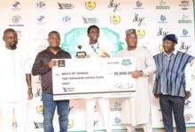 Marfo (middle) receives his prize from Mr Mawuko Afadzinu, President of the Ghana Table Tennis Federation (second right) and other officials