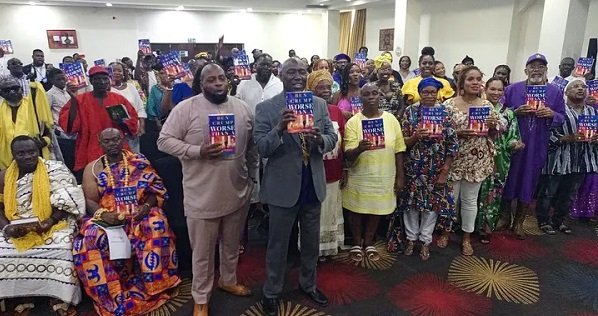 Mr Ben Crump (in suit) and others displaying the book
