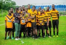 Mrs Buabeng presenting the winners trophy to the captain of Rangers Rugby League School Team A
