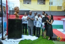 President Mahama (second from left), with Mr. Asiedu Nketiah, (fourth from right), Ms. Zanetor Agyeman-Rawlings, (left), and others applauding after unveiling the bust of the late President Rawlings.jpg