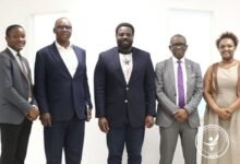 NHIA----Dr Bampoe (middle) with INTERPOL and NHIA officials during the courtesy call