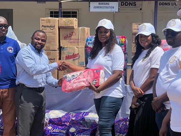 Ms Maria Oquaye (third from right) presenting the items to Dr. Atsutse