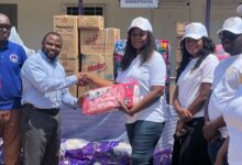 Ms Maria Oquaye (third from right) presenting the items to Dr. Atsutse