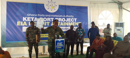 Major-General Kulono (second from left) displaying EPA permit for Keta Port construction
