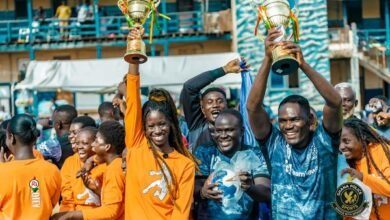 Police and Kalibil captains joined by team mates to celebrate with the trophy