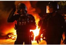 Police officers on a Paris street during fan unrest after PSG won the UEFA Champions League on Saturday