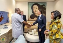 President Mahama (left) being welcomed by UK officials during the visit