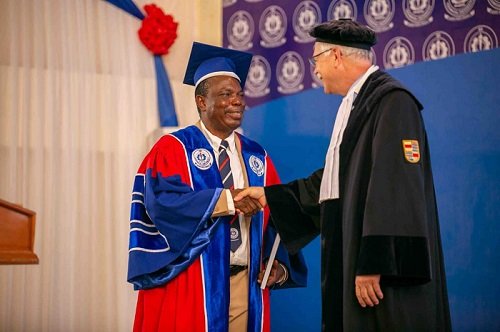 Professor Honyenuga (left) congratulating Prof Tuninga after the lecture