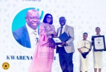 Responsible Journalism Pix---------Mrs Asante-Asiedu (left) receving an award from Sports Broadcaster, Kwabena Yeboah