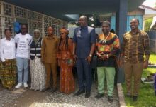 Mr Bediako (third from right) and Mr Azumah (fourth from right) with some refugees and executives of the Ghana Refugee Board