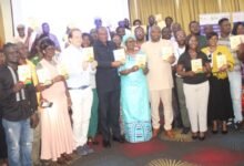 Mr. Abdul-Rashid Pelpuo (seventh from left), Ms. Fatou Diallo Ndiaye (seventh from right), and Mr. Andreas Berding (sixth from left) with other guests launching the code of ethics document. Photo Ebo Gorman
