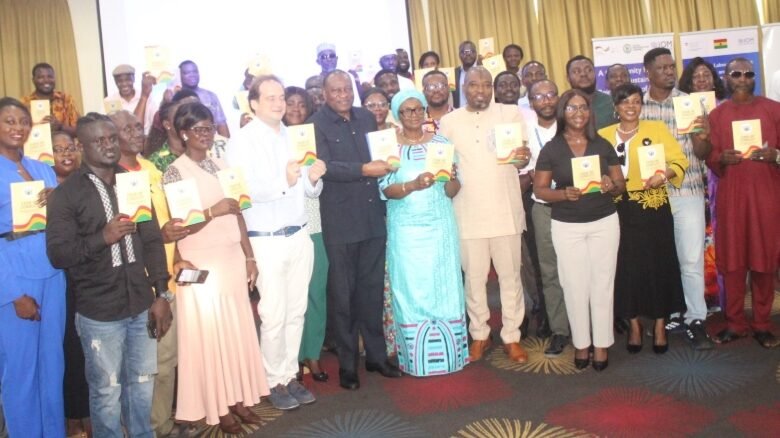 Mr. Abdul-Rashid Pelpuo (seventh from left), Ms. Fatou Diallo Ndiaye (seventh from right), and Mr. Andreas Berding (sixth from left) with other guests launching the code of ethics document. Photo Ebo Gorman