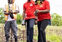 Ms Obo-Nai planting a seedling