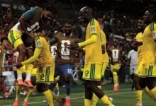 Thapelo Maseko is mobbed by his team-mates after scoring the only goal