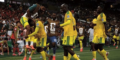 Thapelo Maseko is mobbed by his team-mates after scoring the only goal