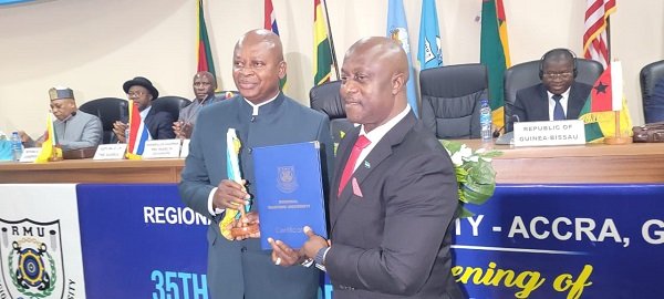 Ambassador Turay (right) officially handing over the Chancellorship to Mr Nikpe
