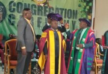 Mr. Nelson, (back) assisted by Prof. Amankwah to robe Mr. Bedai during UMaT’s congregation