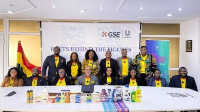 Mr Wulff-Caesar (seated fourth from left) with management staff of th company