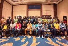 Vice President, Professor Opoku-Agyemang (seated middle) with the Black Stars management and players during the visit