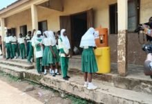• Students of English and Arabic JHS in Nandom washing their hands at the WASH facility