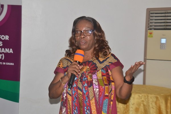 Mrs Akakpo (inset) addressing the gathering at the programme Photo Victor A. Buxton
