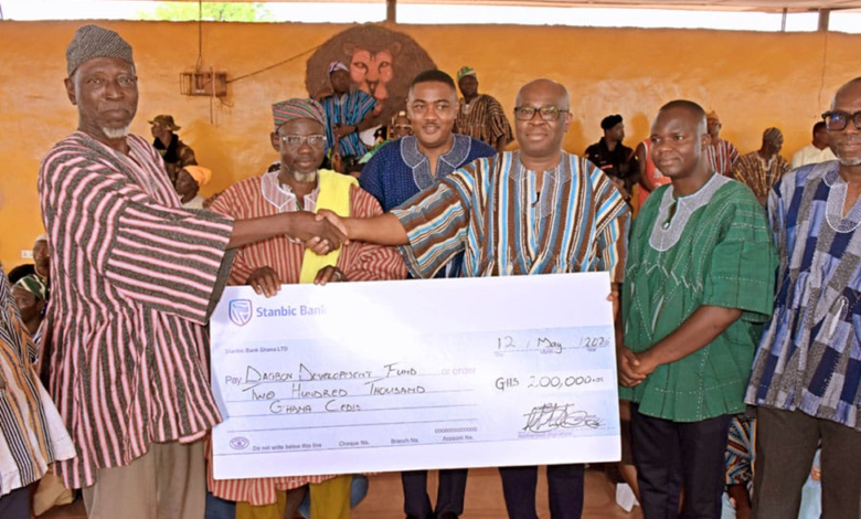 Mr Asomaning (second from right) presenting the cheque to representatives of the Yaa Naa