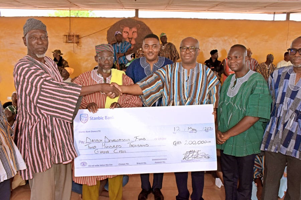Mr Asomaning (second from right) presenting the cheque to representatives of the Yaa Naa