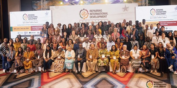Mr Camara (seated fourth from left) with dignitaries and participants during the conference