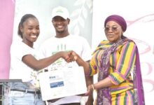 Ms Alexandra (left), presenting the items to Hajia Abdul Aziz Fatahiya (right,)