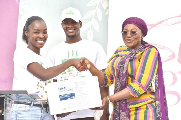 Ms Alexandra (left), presenting the items to Hajia Abdul Aziz Fatahiya (right,)