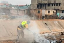 A resident burning refuse collected during the cleanup exercise