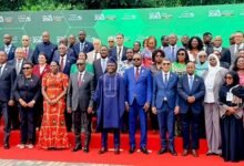-Mr Akandoh (middle) with other participants after the summit