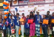 Some of the students displaying their awards and gift after the competition