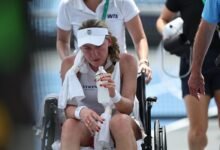 Alexandrova was helped off court in a wheelchair after collapsing