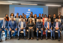 Dr Asiama (seated third from right) with his deputies and members from the MPC and some students