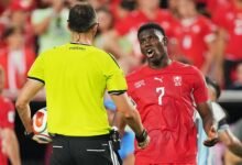 Breel Embolo remonstrates with referee Joao Pedro Silva Pinheiro during the Argentina versus Switzerland quarter final game