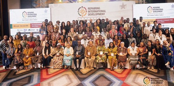 Mr Camara (seated fourth from left) with other dignitaries during the conference