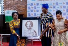 Vice President Jane Naana Opoku-Agyemang, (left) receiving a photograph of herself at the anniversary