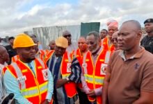 Dr Adamtey (second from right) with other members of the Council, NADMO and Mr Lamptey during the tour