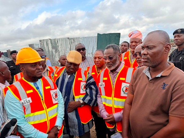 Dr Adamtey (second from right) with other members of the Council, NADMO and Mr Lamptey during the tour