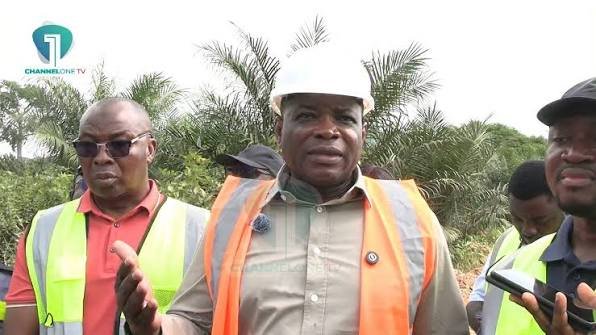 Mr Agbodza (right) speaking after inspecting one of the roads